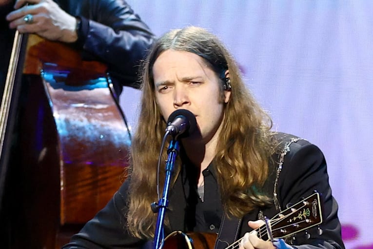 Billy Strings performs in protective helmet after being struck by object on stage the night before