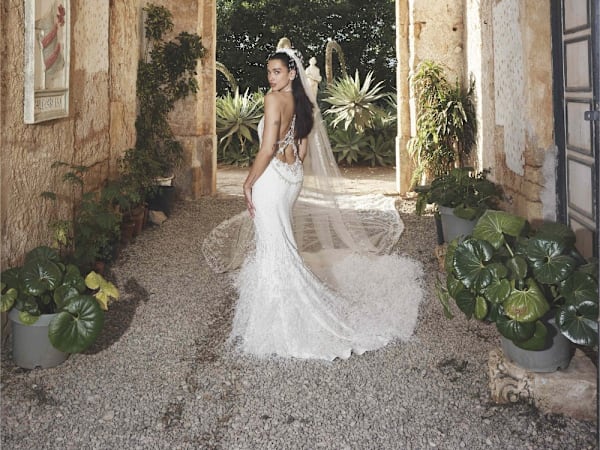 Dua Lipa's backless Chanel couture wedding dress is dripping in 480,000 beads and 25,000 feathers