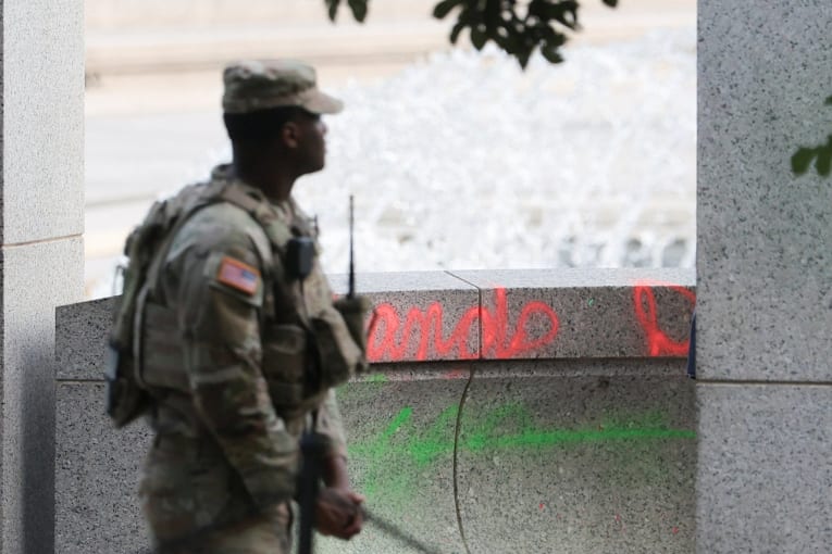 Woman who left message in spray paint on DC memorial is indicted on 2 federal counts, DOJ says