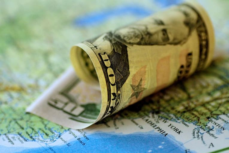 Dollar hovers near multi-month lows as Treasury yields slip; Fed minutes awaited