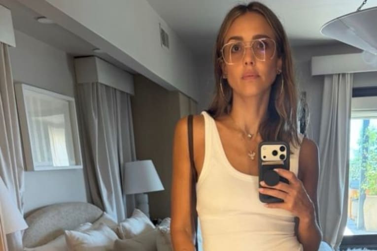 Jessica Alba makes waves in an animal-print bikini and vintage, burgundy-framed sunglasses