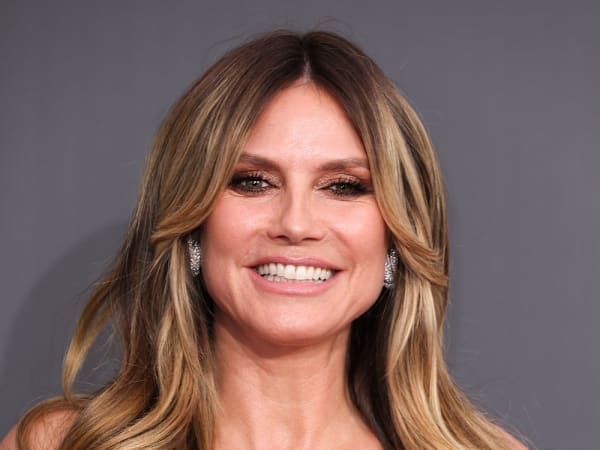 Heidi Klum walks the Project Runway ramp in zipped-up top with daring vibe