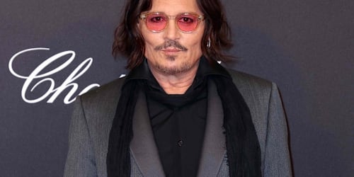 Johnny Depp looks nearly unrecognizable with salt-and-pepper hair, colored contacts