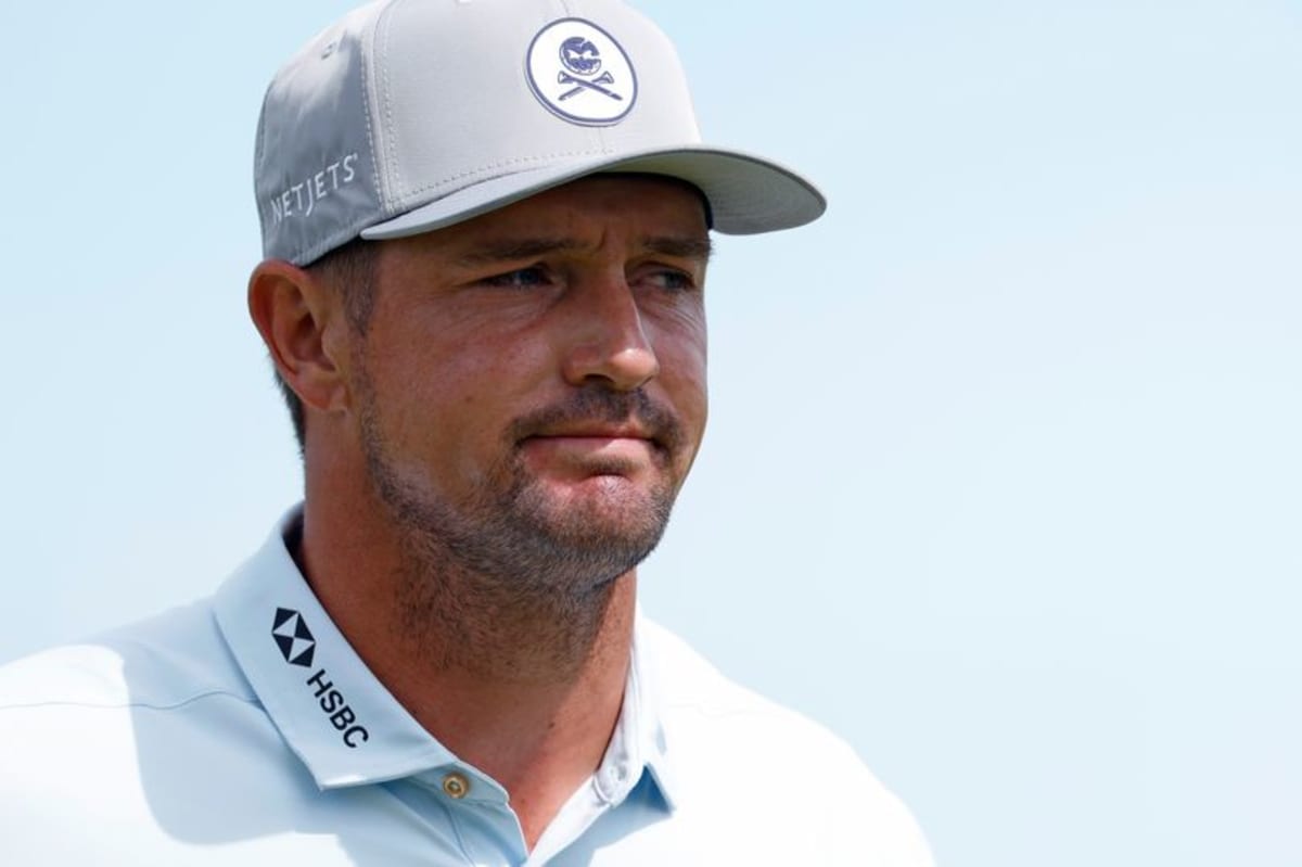 Bryson DeChambeau watching his putt on the ninth green during tournament play.