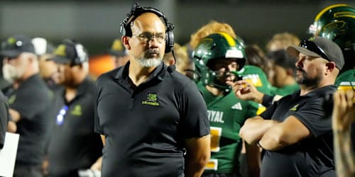 A California high school football coach was fired after kicking a football at player