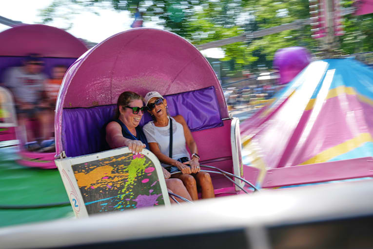 Spinning and dipping, Minnesota fairgoers delight in the classic Tilt-A-Whirl ride as it turns 100