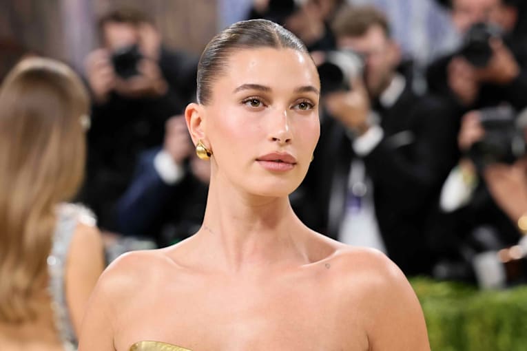Hailey Bieber sizzles in a tiny highlighter yellow string bikini
