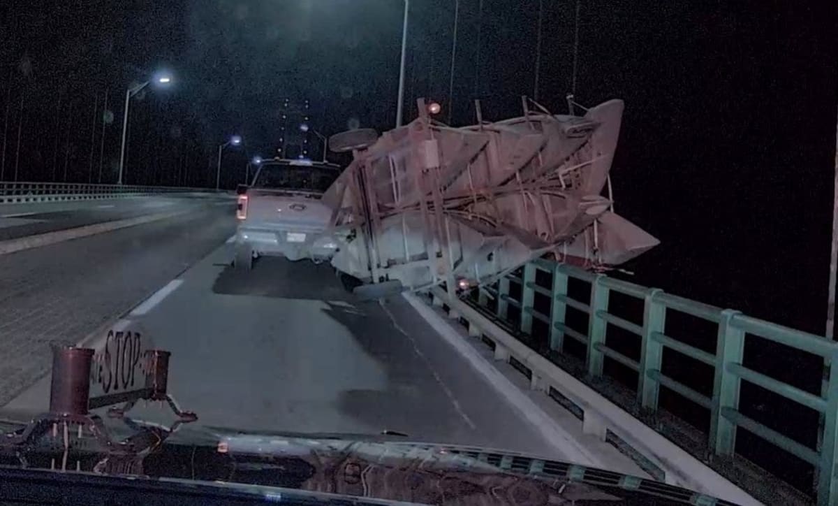 High Wind Sign High winds flip trailer on Mackinac Bridge. How they got it across - AOL