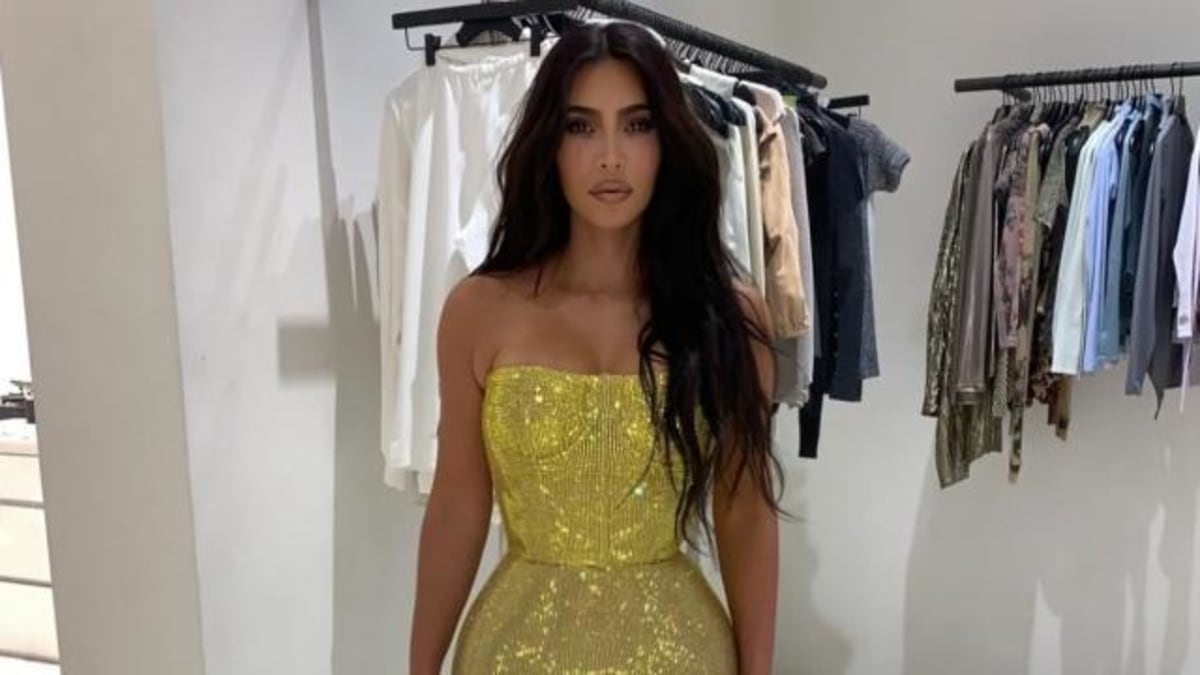 Kim Kardashian Pulls Off a Gold Plunging Halter Dress That Leaves Little Room for Subtlety