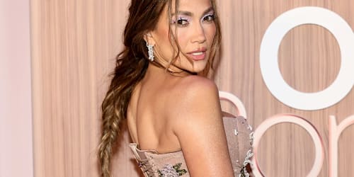 Jennifer Lopez wears dramatic black dress and dazzling bling to Taylor-Travis wedding