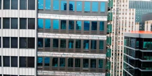 NYC high-rise in danger of collapse faced complaints, including workers blowing material off roof with a leaf blower