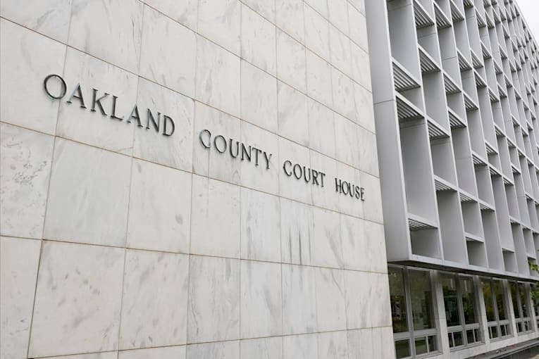 Michigan woman pleads no contest to abuse after 3 kids are found living alone for years