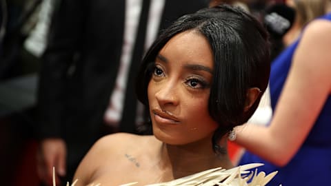 Simone Biles sets record straight about Swift, Kelce wedding invite