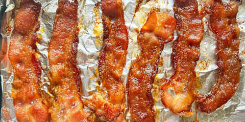 For 'seriously crispy' bacon, Ina Garten says to sprinkle this on top before cooking it