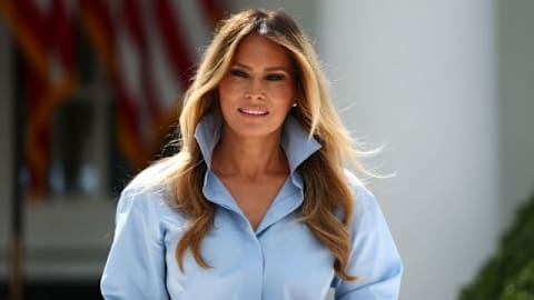 Melania Trump leaves Michael Kors shirt unbuttoned over red Dior skirt, delivering a masterclass in power dressing