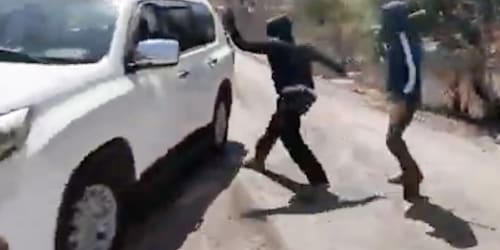 Palestinian woman and NBC News team attacked by masked Israeli settlers in West Bank