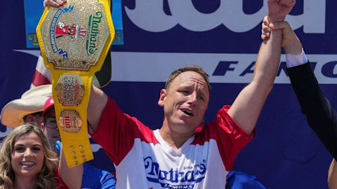 Eating champion Joey Chestnut defends title but blames heat for lower hot-dog tally
