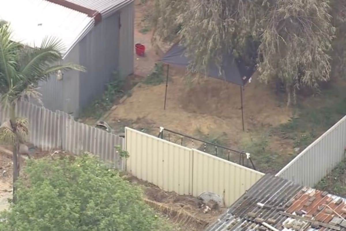Twin brother charged with murder after sibling's body found in backyard