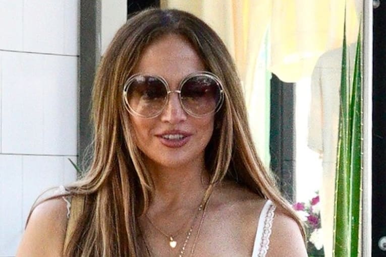 J.Lo&rsquo;s breezy summer look includes a sheer skirt and statement micro bag
