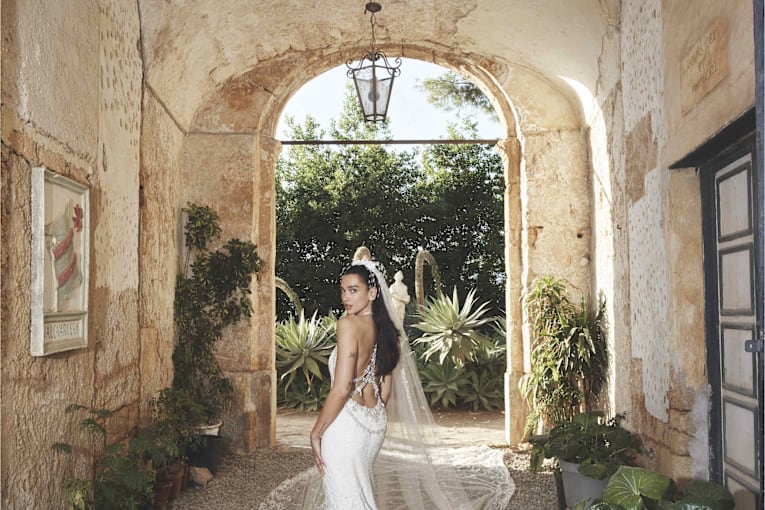 Dua Lipa's backless Chanel couture wedding dress is dripping in 480,000 beads and 25,000 feathers