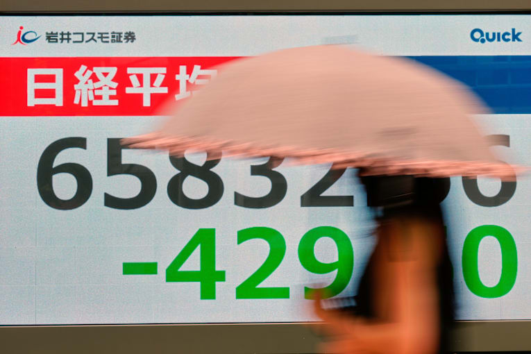 Asian stocks are mixed after Wall Street retreats following economic updates