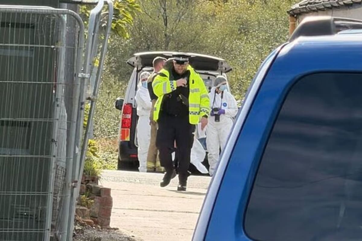Man arrested on suspicion of murder after body found in burning van in ...